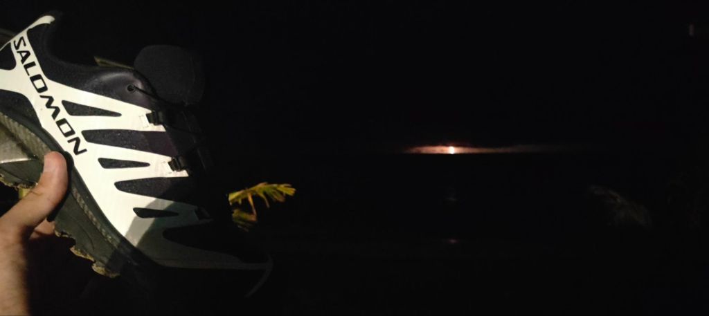 Salomon XT-4 in-hand shot with a Dominican storm happening off the coast of Las Terrenas