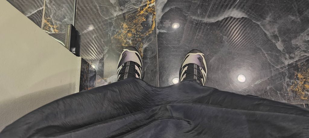 top-down view of Footpatrol x Salomon XT-4 against Marbel flooring in a barbers in Santo Domingo