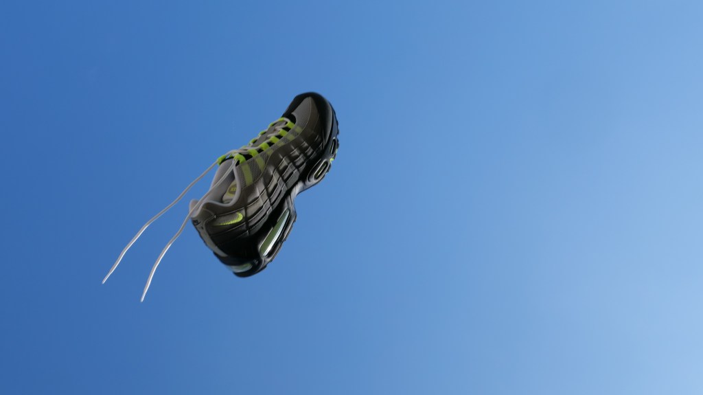 air max 95 neon 2025 being thrown up in air and captured on lumix on sunny day in england