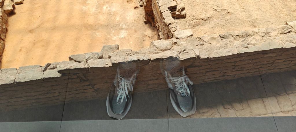 barcelona historic city sectioned off with new balance 990v6 in reflection